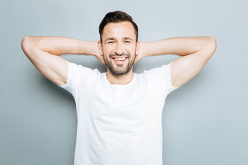 Portrait of delighted brunette that looking at camera