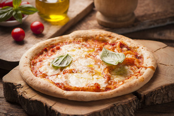 Pizza Margherita on wooden table
