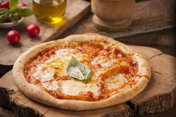 Pizza Margherita on wooden table