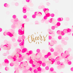 Pink paper confetti and empty card