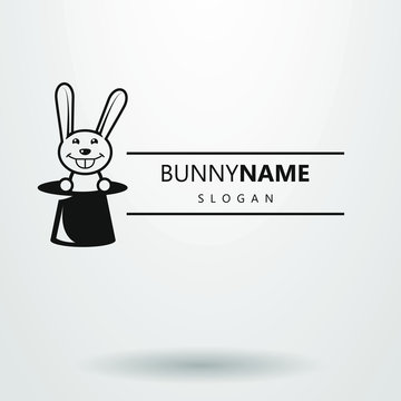 black and white logo with a rabbit in a cylinder