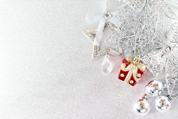Happy New Year, Merry Christmas, celebration or holiday background concept : Red and shiny silver ornaments on bright background, Top view or flat lay with copy space