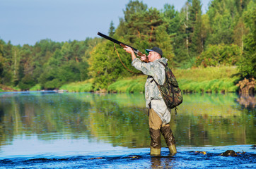 Hunter hunting duck