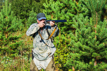 Naklejka premium Hunter on the hunt in late summer