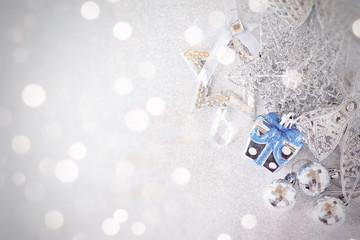 Happy New Year, Merry Christmas, celebration or holiday background concept : Blue and shiny silver ornaments on bright background, Top view or flat lay with copy space