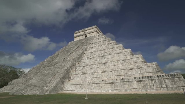 CHICHEN ITZA, MEXICO - MAY 25, 2017: Clouds are moving above Maya pyramid temple of Kukulkan in Mexico