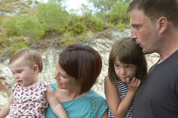 Fototapeta premium Happy family mother, father, child daughter and baby in nature