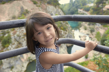Sweet little girl is smiling in nature
