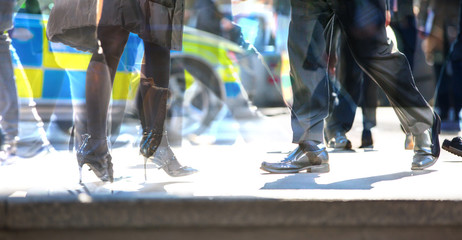 Walking people in the City of London. Multiple exposure image, modern life concept.