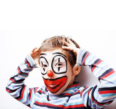 little cute boy with facepaint like clown, pantomimic expression
