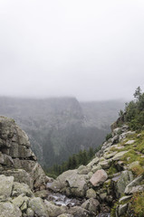 Fototapeta na wymiar Foggy and cloudy landscape, Mountains, Clouds. National Park Ergaki, Siberia, Russia