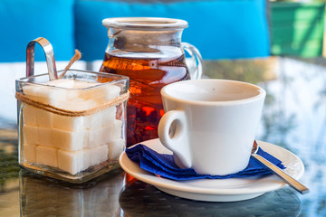 White teaset on tray in restaurant