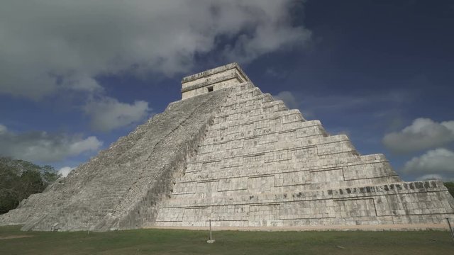 CHICHEN ITZA, MEXICO - MAY 25, 2017: Clouds move above Maya pyramid temple of Kukulkan in Mexico