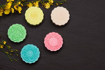 Traditional Chinese mid autumn festival food. Snowy skin mooncakes. The Chinese words on the mooncakes is green tea with red bean paste, noble delight and lotus paste, not a logo or trademark.