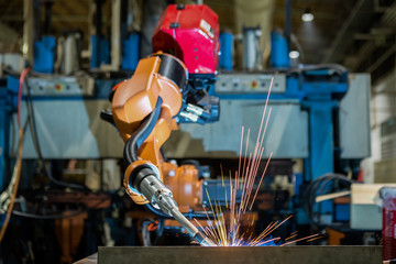 Robot welding is movement welding steel part in factory
