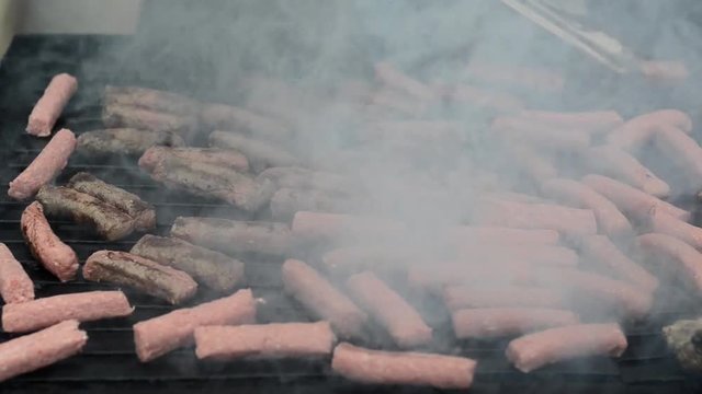 Cevapcici, cevapi on the grill. Balkans traditional food. Grilled dish of minced meat. Grilled meat on the barbecue 