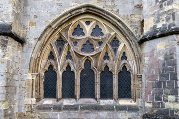 Exterior view of stained-glass gothic window with tracery of cut stone in the Cathedral Church of...