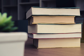 Pack of Book stack on table in working room at office