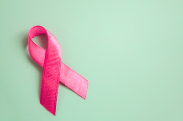 pink ribbon breast cancer on a blue background. top view  top. Place for text