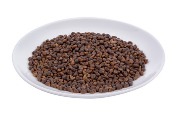 Morning glory seed in white plate on white background