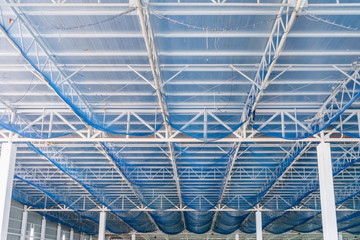 Structure of steel roof frame and metal sheet in building construction site