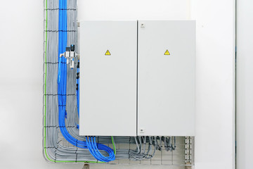 electricity distribution box with wires and circuit breakers (fuse box)