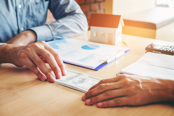 Hand giving money United States Dollars bills ,Hand receiving money from businessman
