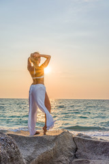 Fototapeta na wymiar Classy woman on the beach in Greece