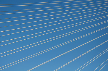 Cables over the blue sky