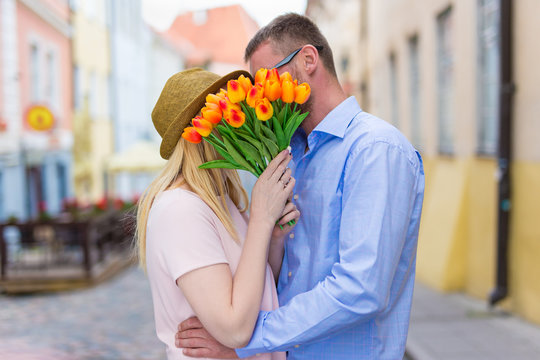 Love And Relationship Concept - Young Couple Kissing In The City