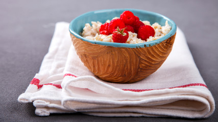 Oatmeal Porridge with fresh Berries,Raspberry.Breakfast.Concept of Healthy Eating. Copy space.selective focus.