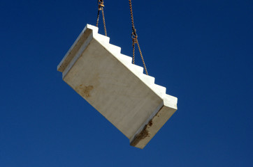 Stair segment lifted with a crane.