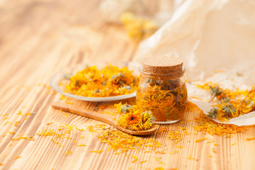 Calendula flowers at home recipes on the wooden table - obrazy, fototapety, plakaty