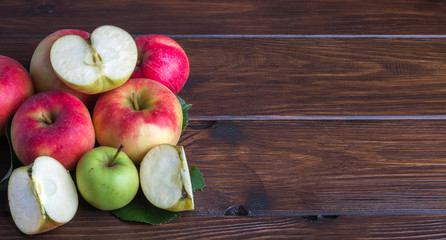 biological apples on a wooden table sliced