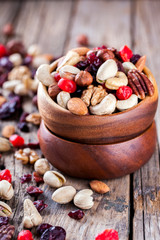 Nuts and dried fruit mix. Concept of Healthy Food. Vintage wooden background. Copy space for Text. selective focus