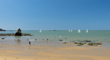 Fototapeta na wymiar Brittany Beach - rocks, sand, sea ships and sky