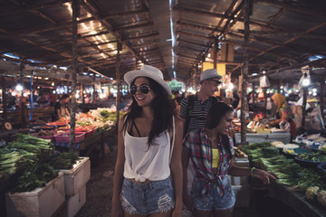 Tourists Walking Between Rows On Tropical Exotic Market Young People Choosing Fresh Fruits And Vegetables In Asian Traditional Bazaar