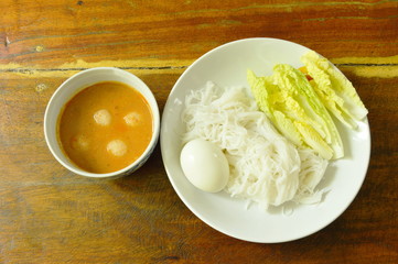 rice noodles and Chinese cabbage eat couple with fish curry on bowl