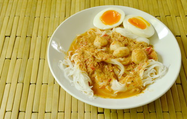 rice noodles with fish curry topping boiled creamy egg yolk