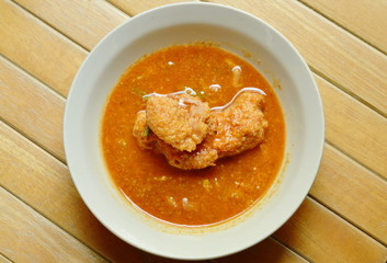 boiled fish egg in spicy and sour soup on bowl