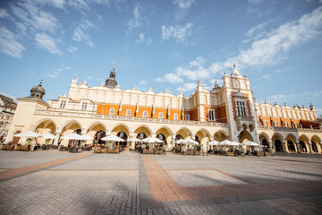 Fototapeta premium Cityscape view on the Market square with Cloth Hall main building during the morning light in Krakow, Poland
