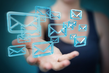 Businesswoman holding and touching floating emails 3D rendering