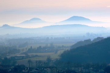 Hills in winter with fog