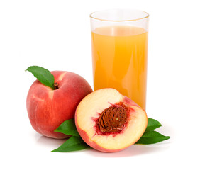 Glass of fruit juice and cut peaches isolated on white background