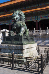 Fototapeta na wymiar Statue of a Chinese Guardian Lion at the Forbidden City in the city of Beijing, in China