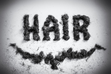 Hairdressers hair sign made from facial beard clippings in an old style retro fashion