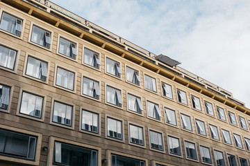 Fototapeta na wymiar brown office building with square windows
