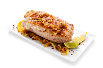 Roast ham with vegetables on white background