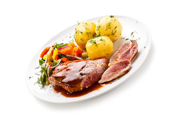 Grilled steak with vegetables on white background