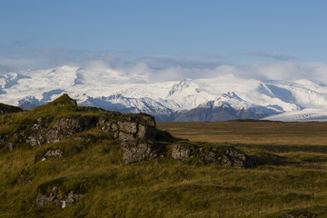 Landscape in island with glacier-covered mountains